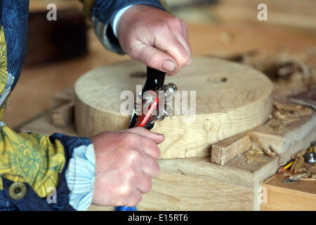 Hay on Wye, Wales, UK. 23rd May 2014. Pictured: A woman working the wood. Re: The Telegraph Hay Festival, Hay on Wye, Powys, Wales UK. Credit:  D Legakis/Alamy Live News Stock Photo