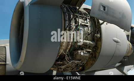 Boeing C-17 Globemaster III jet engine with open side panels. Stock Photo