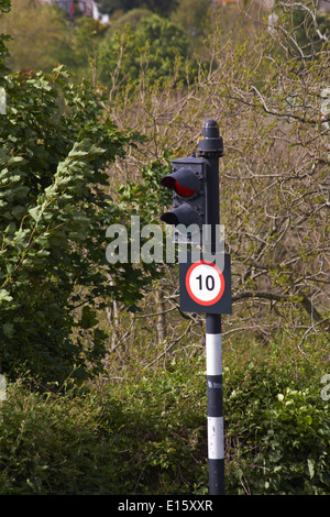 10 speed limit road sign opposite the entrance to Carisbrooke Castle, Newport, Isle of Wight, Hampshire UK in May Stock Photo