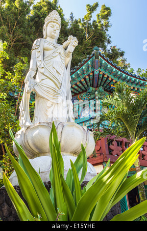 Goddess statue in front of the World Peace Pagoda at Mu Ryang Sa Temple, a Korean buddhist temple on Oahu, Hawaii Stock Photo