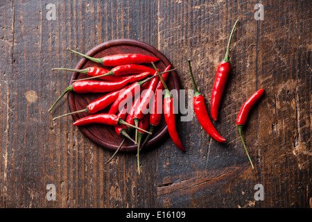 Red Hot Chili Peppers on wooden background Stock Photo