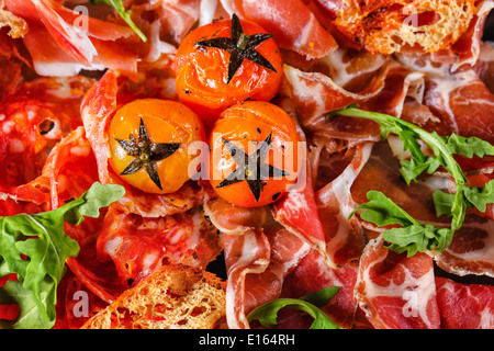 Bacon and sun-dried tomatoes shot closeup, restaurant food Stock Photo
