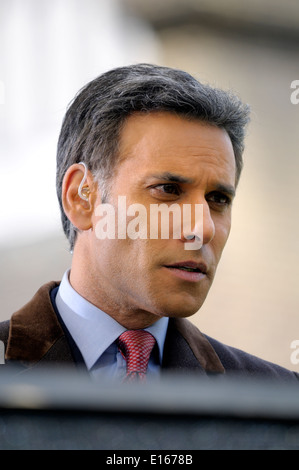 Matthew Amroliwala (BBC television newsreader) doing an outside election broadcast from College Green, Westminster. 2014 Stock Photo