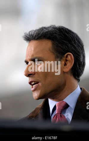 Matthew Amroliwala (BBC television newsreader) doing an outside election broadcast from College Green, Westminster. 2014 Stock Photo