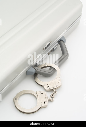Zero Halliburton aluminium briefcase ( aluminum ) a classic movie MacGuffin with Smith & Wesson handcuffs Stock Photo