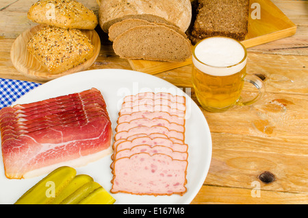 Cold meat, pickles, whole wheat bread and beer, a traditional German cold meal Stock Photo