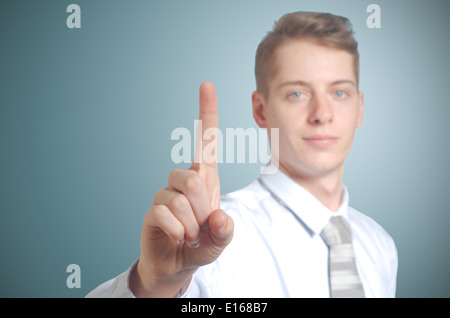 Businessman pushing imaginary button one finger - insert own concept Stock Photo