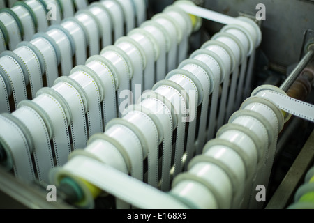 strips of colour film being processed at tony scotts film lab in london Stock Photo