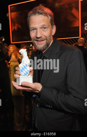 Munich, Germany. 23rd May, 2014. The actor Kai Wiesinger celebrates after the presentation of the Bavarian TV award 2014 in Munich, Germany, 23 May 2014. The Bavarian TV award in shape of a panther is presented since 1989. Photo: Ursula Dueren/dpa/Alamy Live News
