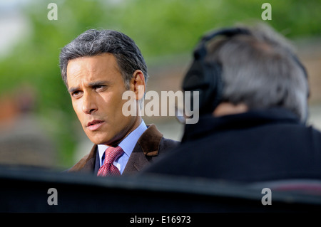 Matthew Amroliwala (BBC television newsreader) doing an outside election broadcast from College Green, Westminster. 2014 Stock Photo