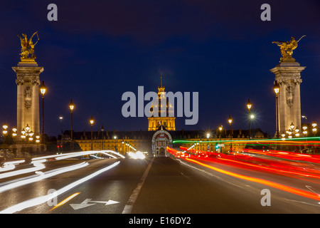 Pont Alexandre III and Les Invalides at night illumination in Paris, France Stock Photo