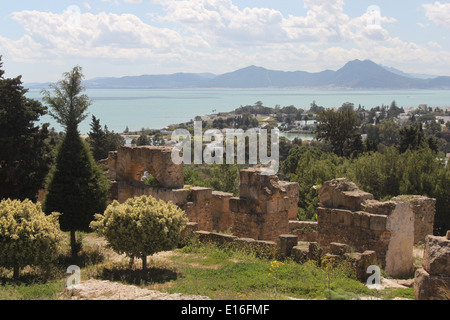 View over the ruins of Carthage towards the bay. The two naval ports are just visible through the trees in the middle distance. Stock Photo