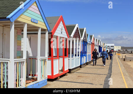 Southwold, Suffolk, England, UK. 24th May 2014. It was a bright and breezy day on the Suffolk coast. People enjoyed a walk beside the beach huts on the seafront at the start of the Bank Holiday weekend. Credit:  Julia Gavin/Alamy Live News Stock Photo
