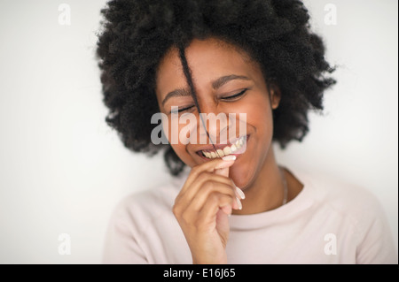 Young woman playing with her hair, Milano, Italy Stock Photo