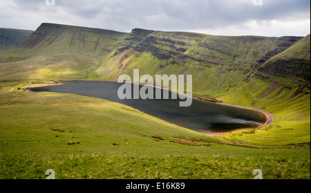 Glacial lake of Llyn y Fan Fach looking towards Picws Ddu and Fan Breicheniog  in the Brecon Beacons National Park Wales UK Stock Photo
