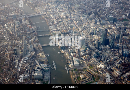 aerial view through aircraft window looking down upon city of London financial district and river thames centre of london UK Stock Photo