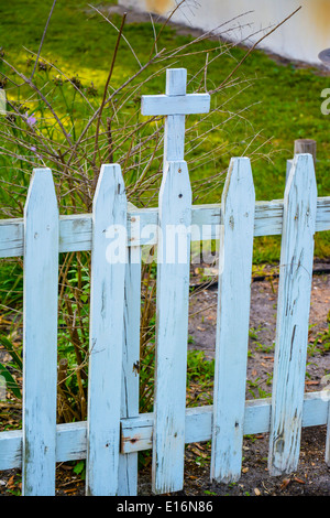 Wooden white picket fence with cross surrounds Our Lady Star of the Sea Catholic Church, circa 1840, in St. Mary's, GA Stock Photo