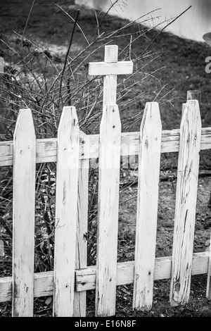 Wooden white picket fence with cross surrounds Our Lady Star of the Sea Catholic Church, circa 1840, in St. Mary's, GA Stock Photo