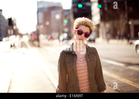 Half-length portrait of young woman in city, Boston, Massachusetts, USA Stock Photo