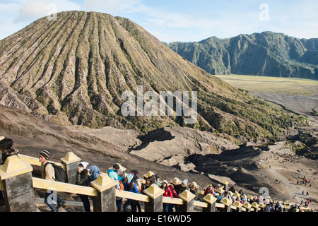 tourists climbing up to the crater of Mount Bromo, East Java, Indonesia Stock Photo