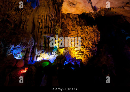 China Guilin.Colorfully lit stalactites and stalagmites inside the Ludi Yan (Reed Flute) caves in Guilin. Stock Photo