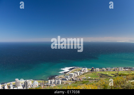 Aerial view of Robben Island in the distance, with Green Point and Sea Anchor Bay seafront areas in the foreground, Cape Town, South Africa Stock Photo