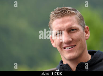 Passeier, Italy. 25th May, 2014. Bastian Schweinsteiger smiles during an interview at the 'media day' of the German national soccer team at the team hotel in St. Leonhard in Passeier, Italy, 25 May 2014. Germany's squad prepares for the upcoming FIFA World Cup 2014 in Brazil at a training camp in South Tyrol until 30 May 2014. Photo: Andreas Gebert/dpa/Alamy Live News Stock Photo