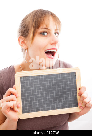 Happy young woman with small blackboard, isolated over white background Stock Photo