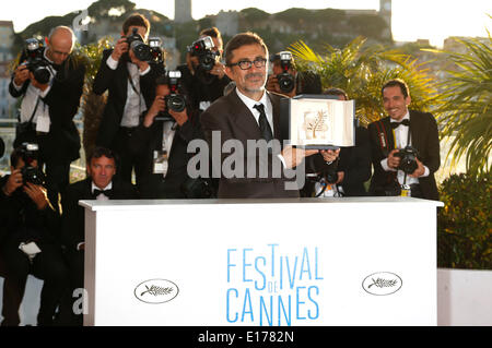 Director Nuri Bilge Ceylan poses with the Palme d'Or for his film 'Winter's Sleeps' during the photocall with the awards winner at the 67th Cannes Film Festival on May 24, 2014 Stock Photo