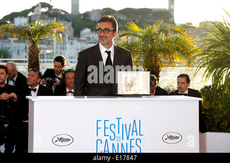 Director Nuri Bilge Ceylan poses with the Palme d'Or for his film 'Winter's Sleeps' during the photocall with the awards winner at the 67th Cannes Film Festival on May 24, 2014 Stock Photo