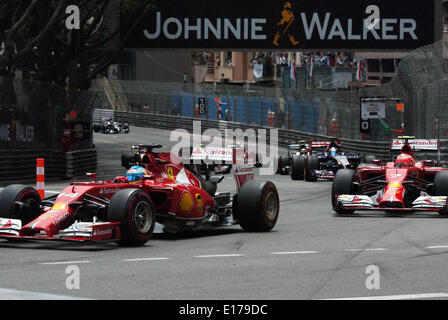 Monte Carlo, Monaco. 25th May, 2014. Ferrari's enter the first corner of the Monaco Formula 1 Grand Prix, Monte Carlo. Credit:  Kevin Bennett/Alamy Live News Stock Photo