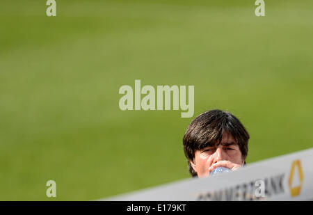 Passeier, Italy. 25th May, 2014. Head coach Joachim Loew of the German national soccer team arrives for a friendly match against the German U20 team on a training ground at St. Leonhard in Passeier, Italy, 25 May 2014. Germany's national soccer squad prepares for the upcoming FIFA World Cup 2014 in Brazil at a training camp in South Tyrol until 30 May 2014. Photo: Andreas Gebert/dpa/Alamy Live News Stock Photo