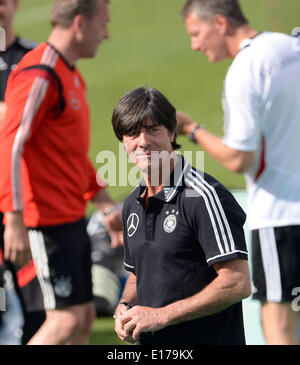 Passeier, Italy. 25th May, 2014. Head coach Joachim Loew (C) of the German national soccer team arrives for a friendly match on a training ground at St. Leonhard in Passeier, Italy, 25 May 2014. Germany's national soccer squad prepares for the upcoming FIFA World Cup 2014 in Brazil at a training camp in South Tyrol until 30 May 2014. Photo: Andreas Gebert/dpa/Alamy Live News Stock Photo