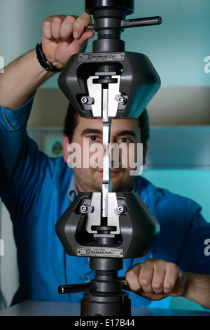 Person using a Shimadzu Autograph AG-IS 100kN universal testing ...