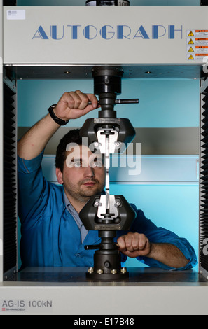 Person using a Shimadzu Autograph AG-IS 100kN universal testing ...