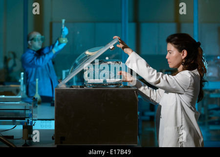 Scientists working in lab Stock Photo