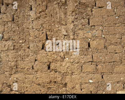 Old brick wall with tiny stones background Stock Photo