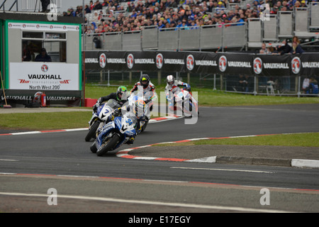 Alistair Seeley leading the pack at the start/finish chicane during the 2014 Vauxhall NW200 road race Stock Photo