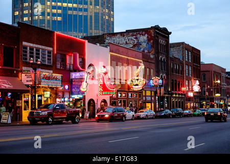 Neon signs illuminate Broadway Street in Downtown Nashville, Tennessee Stock Photo