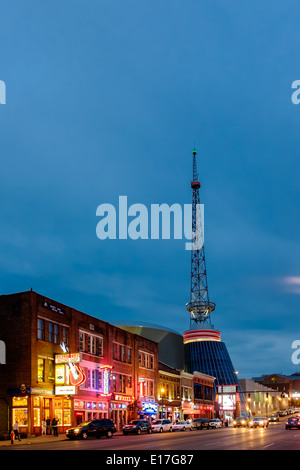 Neon signs illuminate Broadway Street in Downtown Nashville, Tennessee Stock Photo