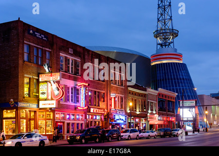 Neon signs illuminate Broadway Street in Downtown Nashville, Tennessee Stock Photo