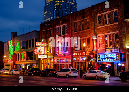 Neon signs illuminate Broadway Street in Downtown Nashville, Tennessee Stock Photo