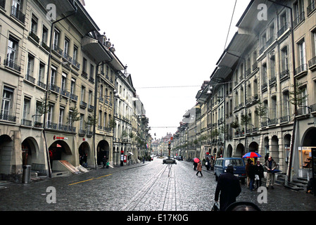 Berne, Switzerland, Europe - July 12th 2013: Visitors walking down the street of Old City of Berne In Switzerland Stock Photo