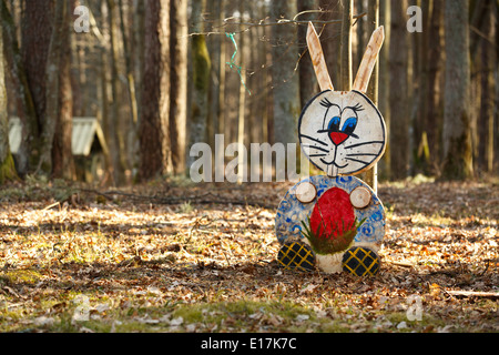 Colorful rabbit family figures in the forest Stock Photo