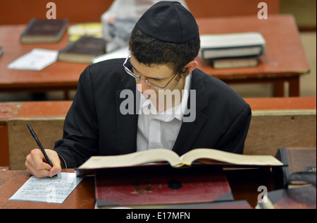 Religious Jewish young man studies at in the synagogue Lubavitch headquarters in Crown Heights, Brooklyn, New York Stock Photo