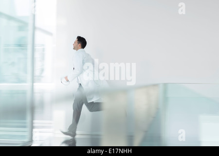 Doctor running in hospital Stock Photo