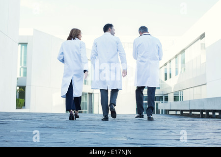 Doctors walking on rooftop Stock Photo