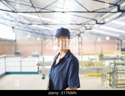 Portrait of confident worker in food processing plant Stock Photo