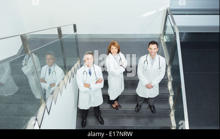 Portrait of confident doctors on stairs Stock Photo