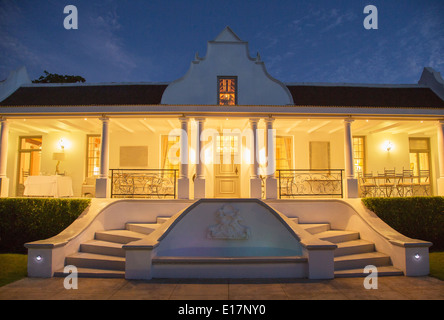 Luxury house with porch illuminated at night Stock Photo